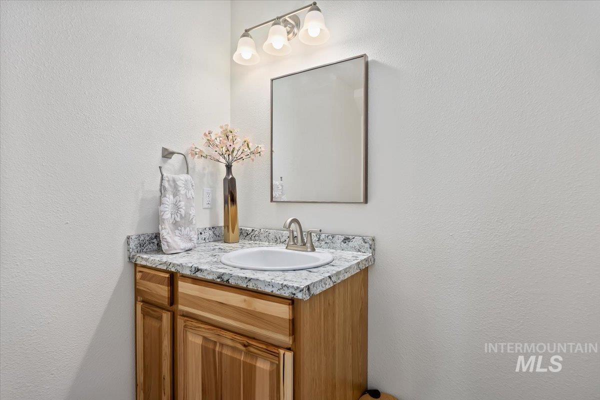3536 North 2300 E Road Filer, ID 83328 - Photo 21 of 47 Bathroom featuring vanity and a textured wall