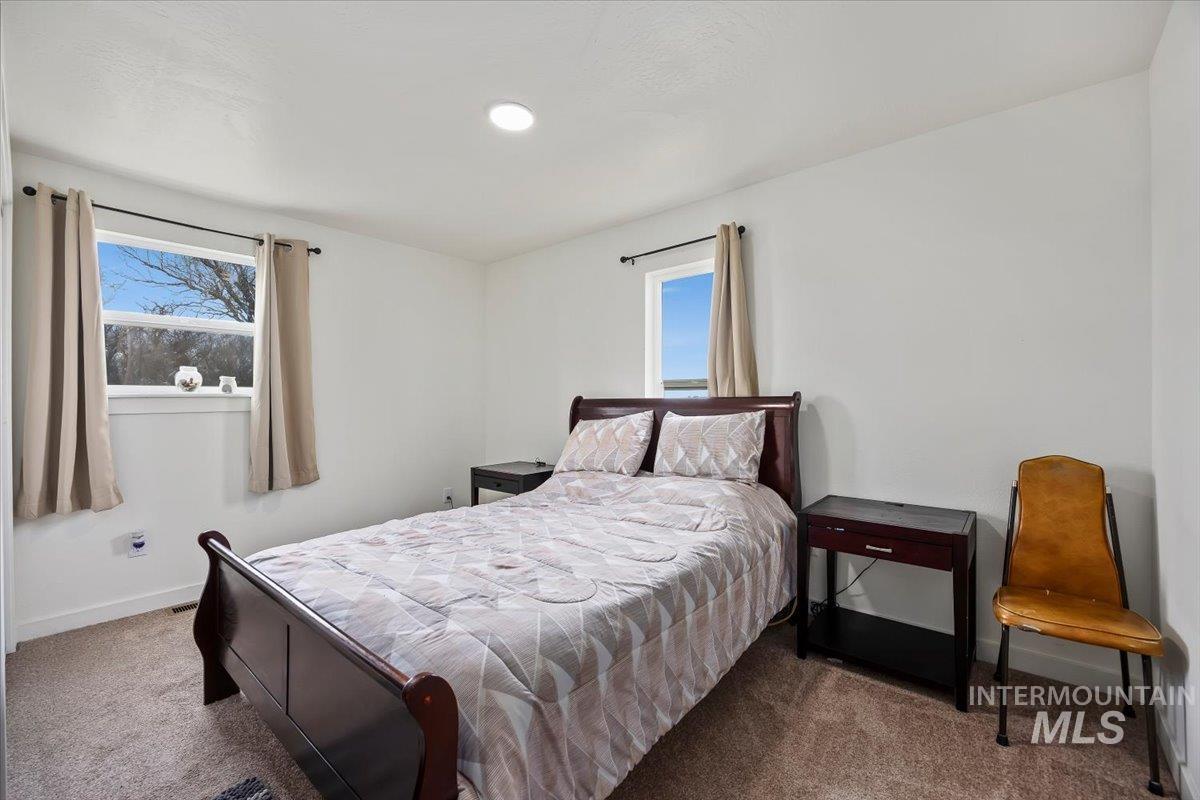 3536 North 2300 E Road Filer, ID 83328 - Photo 22 of 47 Bedroom with baseboards and carpet floors