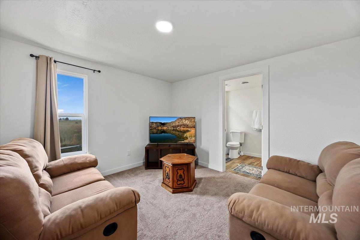 3536 North 2300 E Road Filer, ID 83328 - Photo 6 of 47 Carpeted living room with baseboards