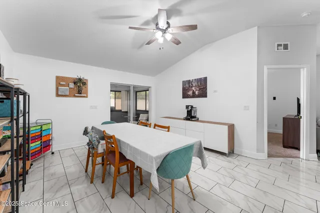a view of a dining room with furniture