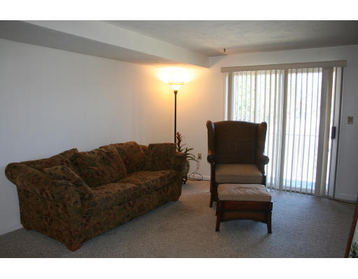 364 Neponset Street, Unit G Canton, MA 02021 - Photo 3 of 14 a living room with furniture and a window