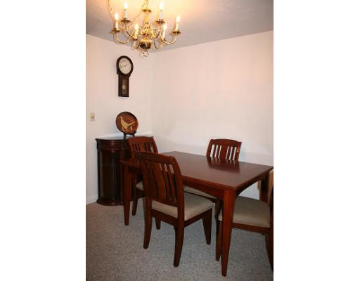 364 Neponset Street, Unit G Canton, MA 02021 - Photo 6 of 14 a view of kitchen with a dining table and chairs