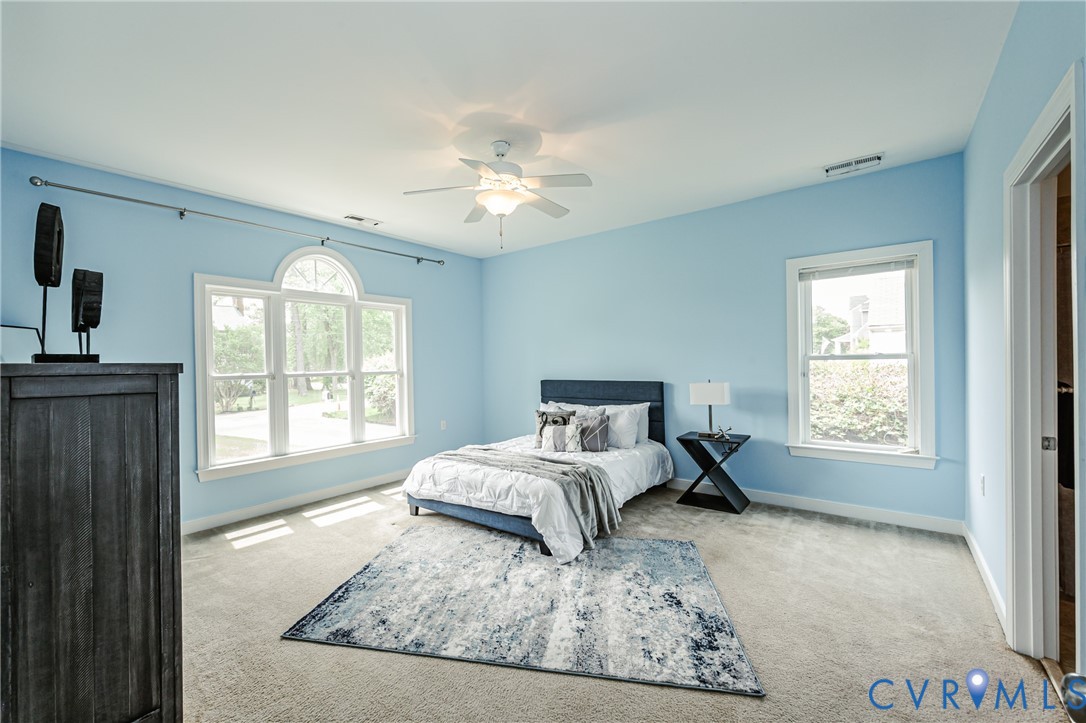 2018 Valentine Road Henrico, VA 23228 - Photo 41 of 65 a bed sitting in a bedroom next to a window