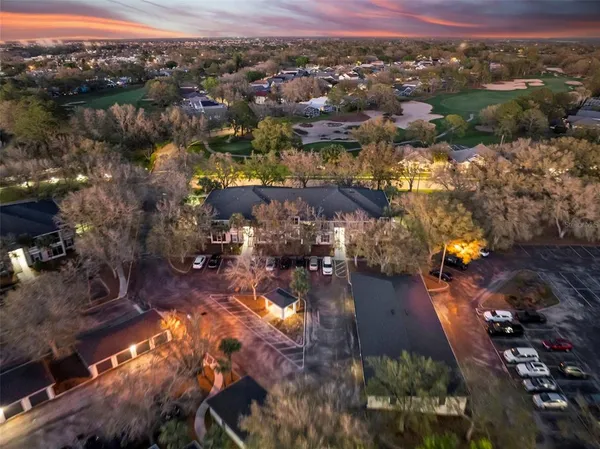 an aerial view of a house with garden space and ocean view