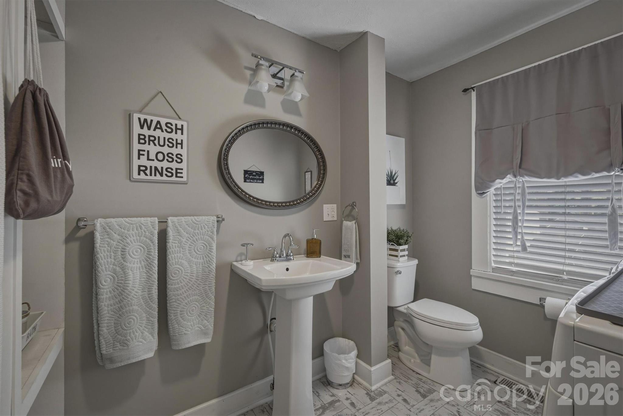 905 Carbon City Road Morganton, NC 28655 - Photo 18 of 29 a bathroom with a toilet sink and mirror