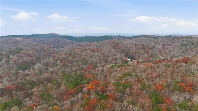 a view of mountain view with lush green forest