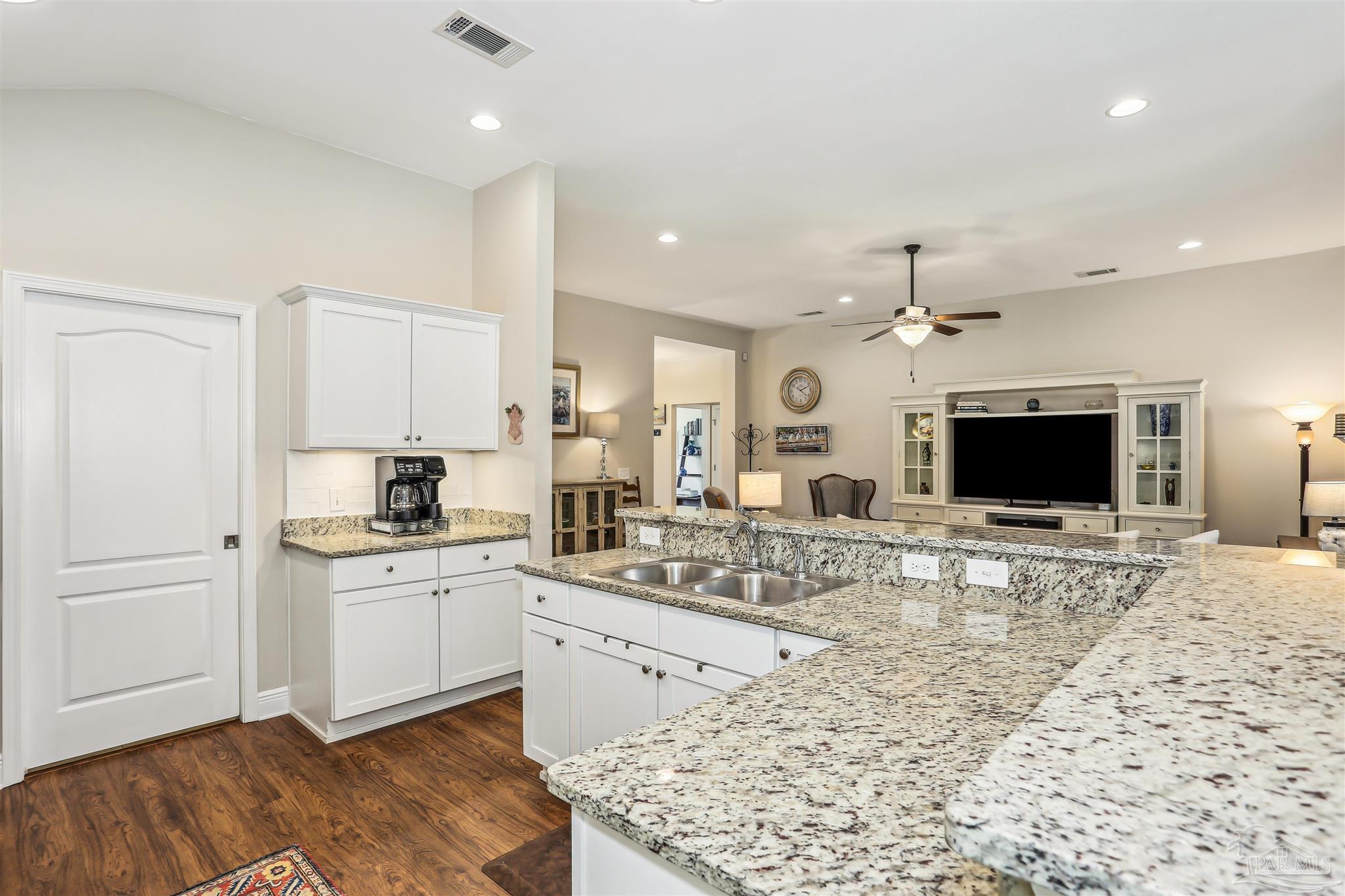 7305 Farmers Road Pensacola, FL 32526 - Photo 13 of 47 a large kitchen with kitchen island a sink stainless steel appliances and cabinets