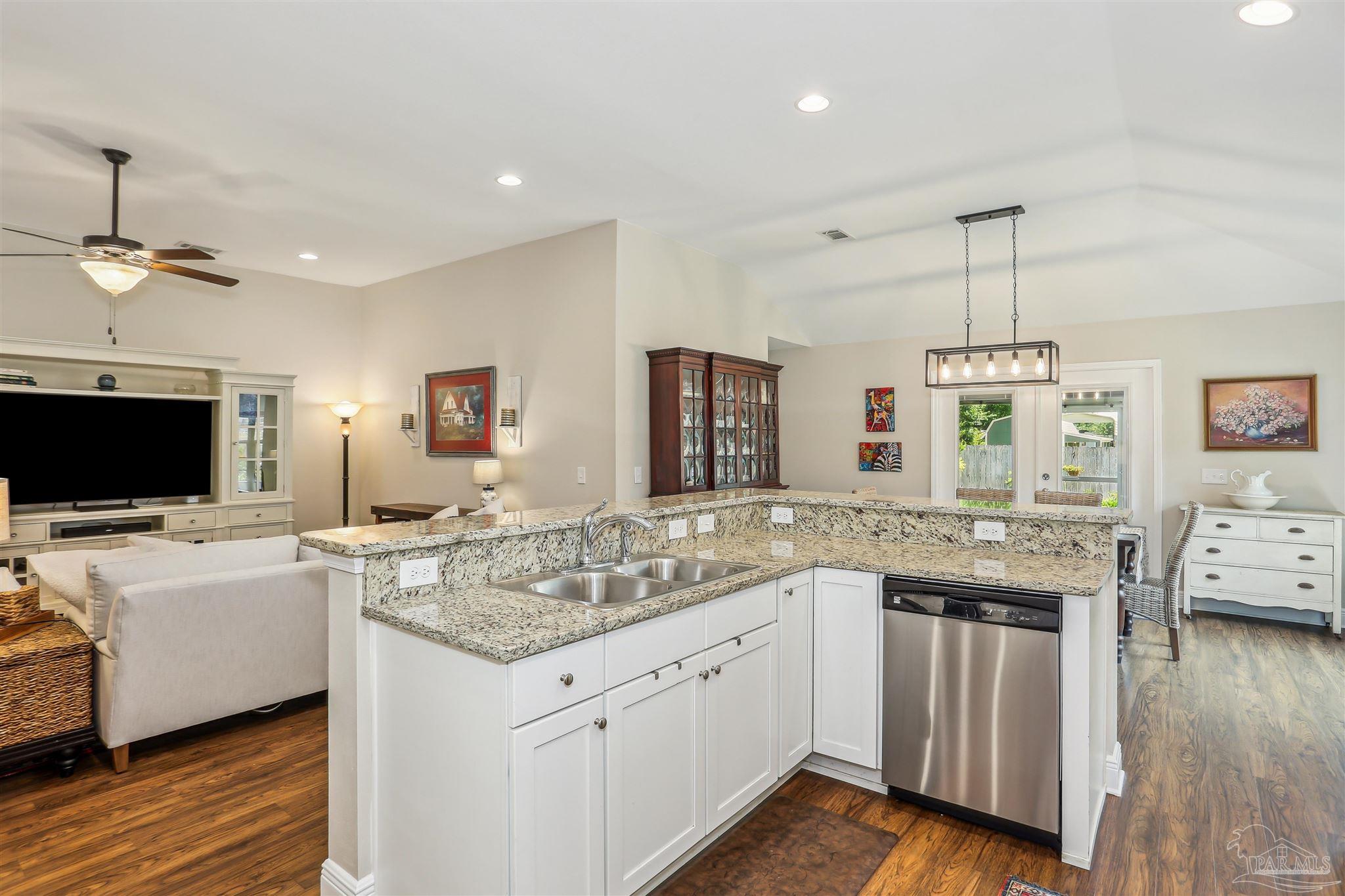 7305 Farmers Road Pensacola, FL 32526 - Photo 15 of 47 a kitchen with a sink and a stove top oven
