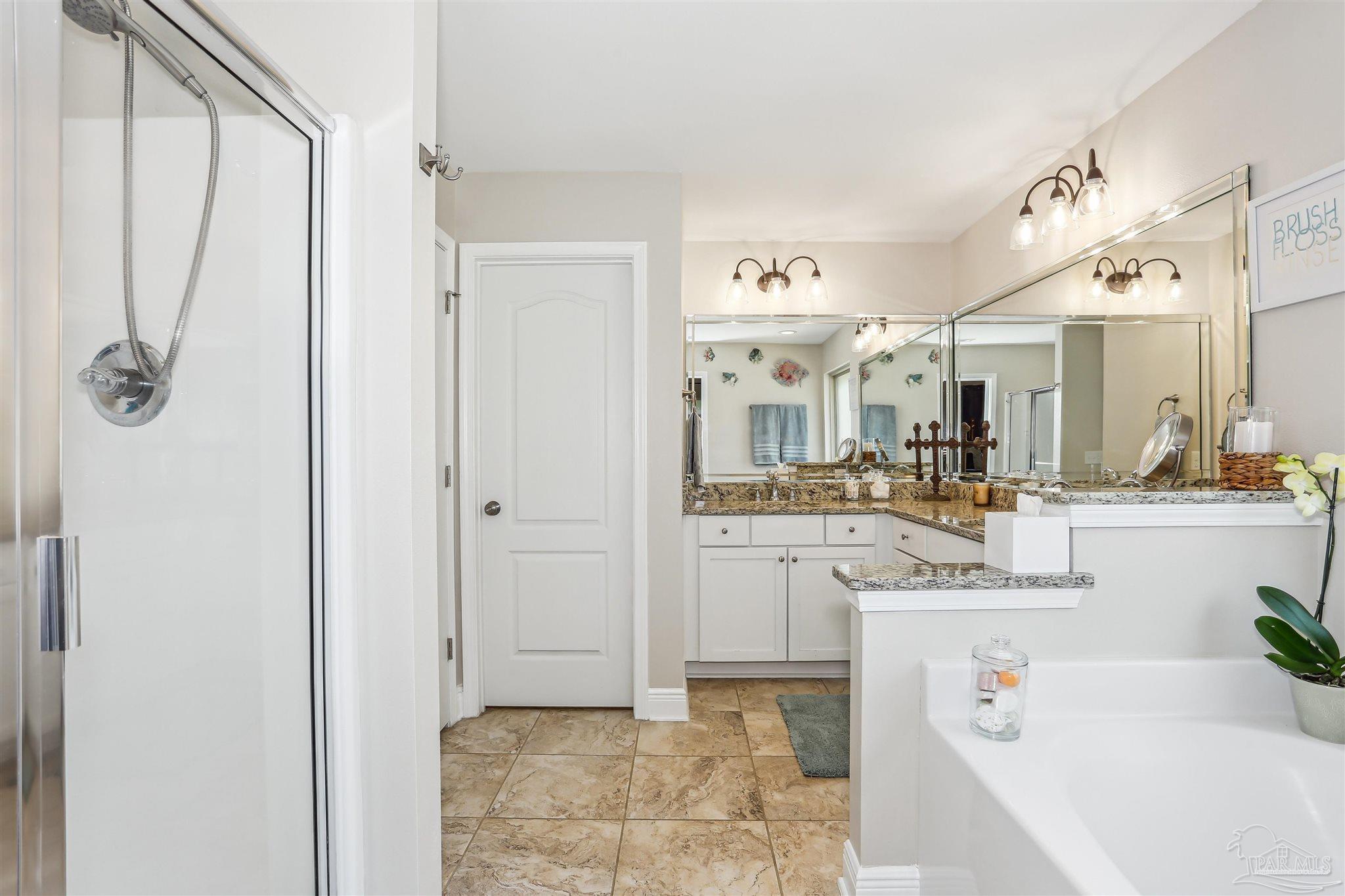 7305 Farmers Road Pensacola, FL 32526 - Photo 21 of 47 a bathroom with a tub sink and mirror