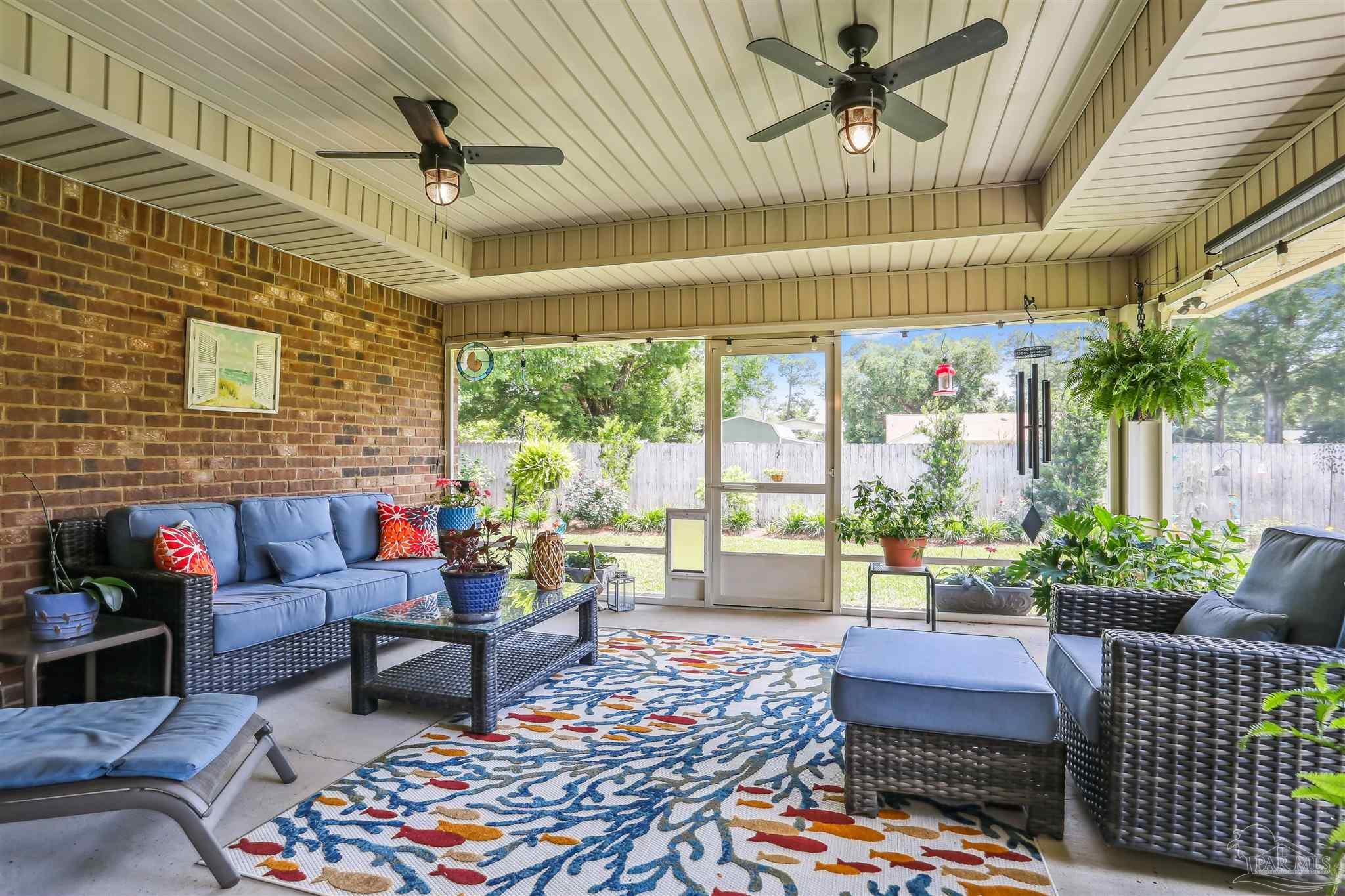 7305 Farmers Road Pensacola, FL 32526 - Photo 29 of 47 a living room with patio furniture and a potted plant