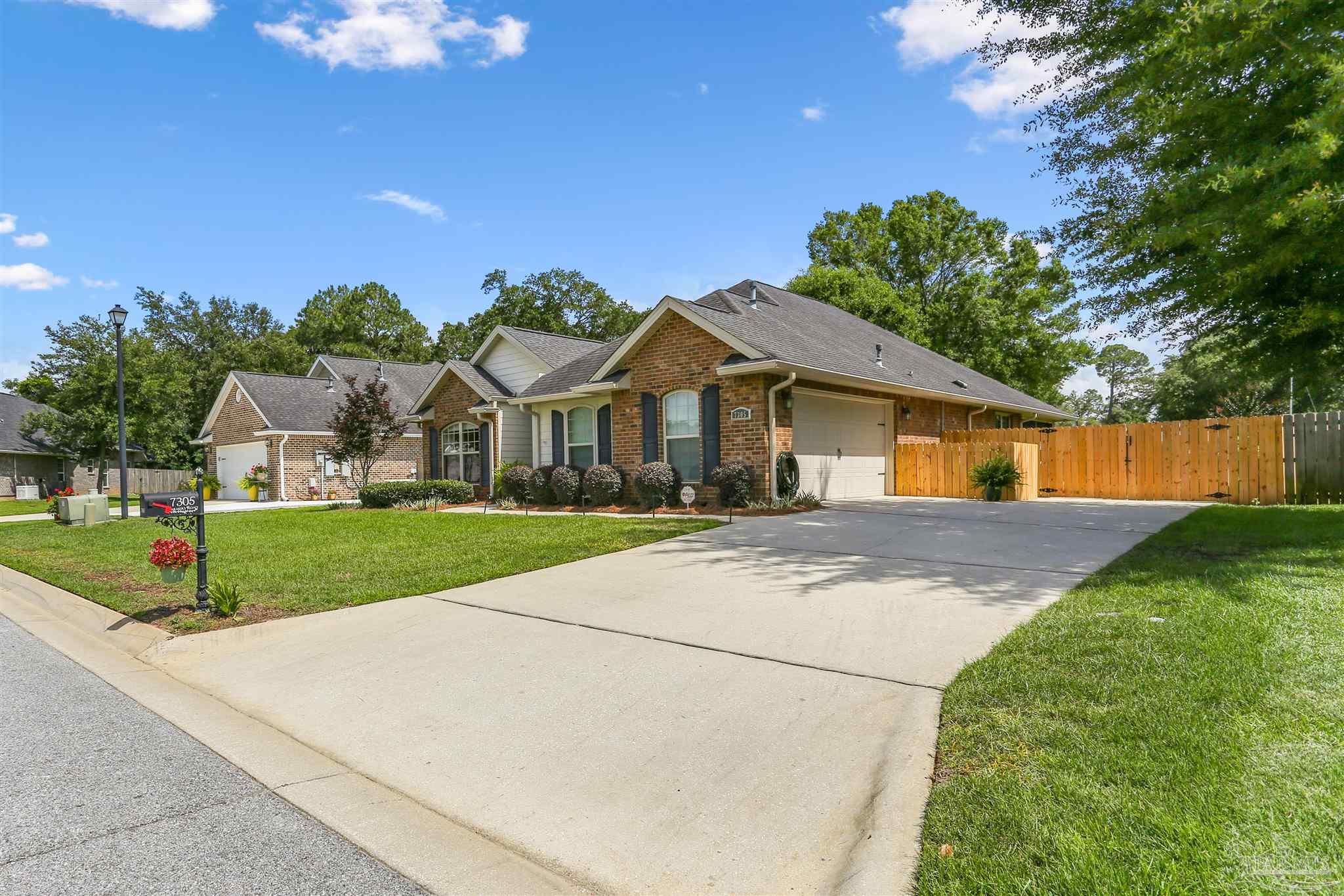 7305 Farmers Road Pensacola, FL 32526 - Photo 3 of 47 a front view of house with yard and green space