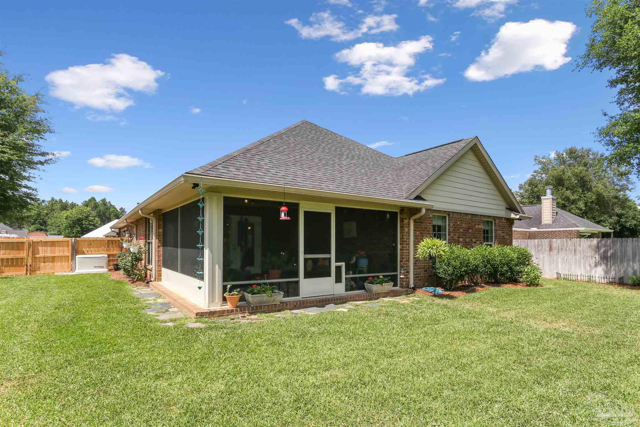 7305 Farmers Road Pensacola, FL 32526 - Photo 36 of 47 a view of a house with a yard