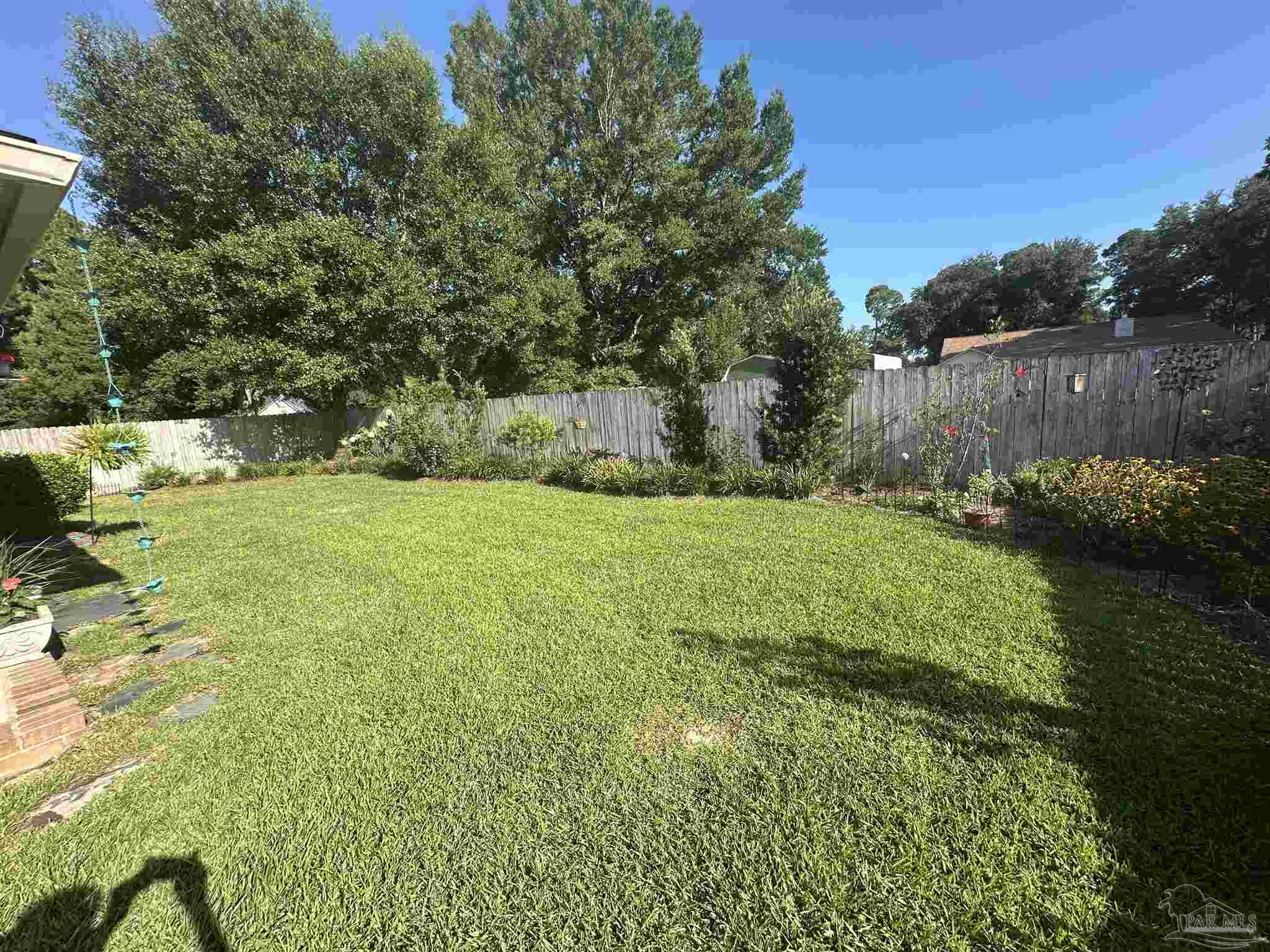 7305 Farmers Road Pensacola, FL 32526 - Photo 38 of 47 a view of a garden with a tree