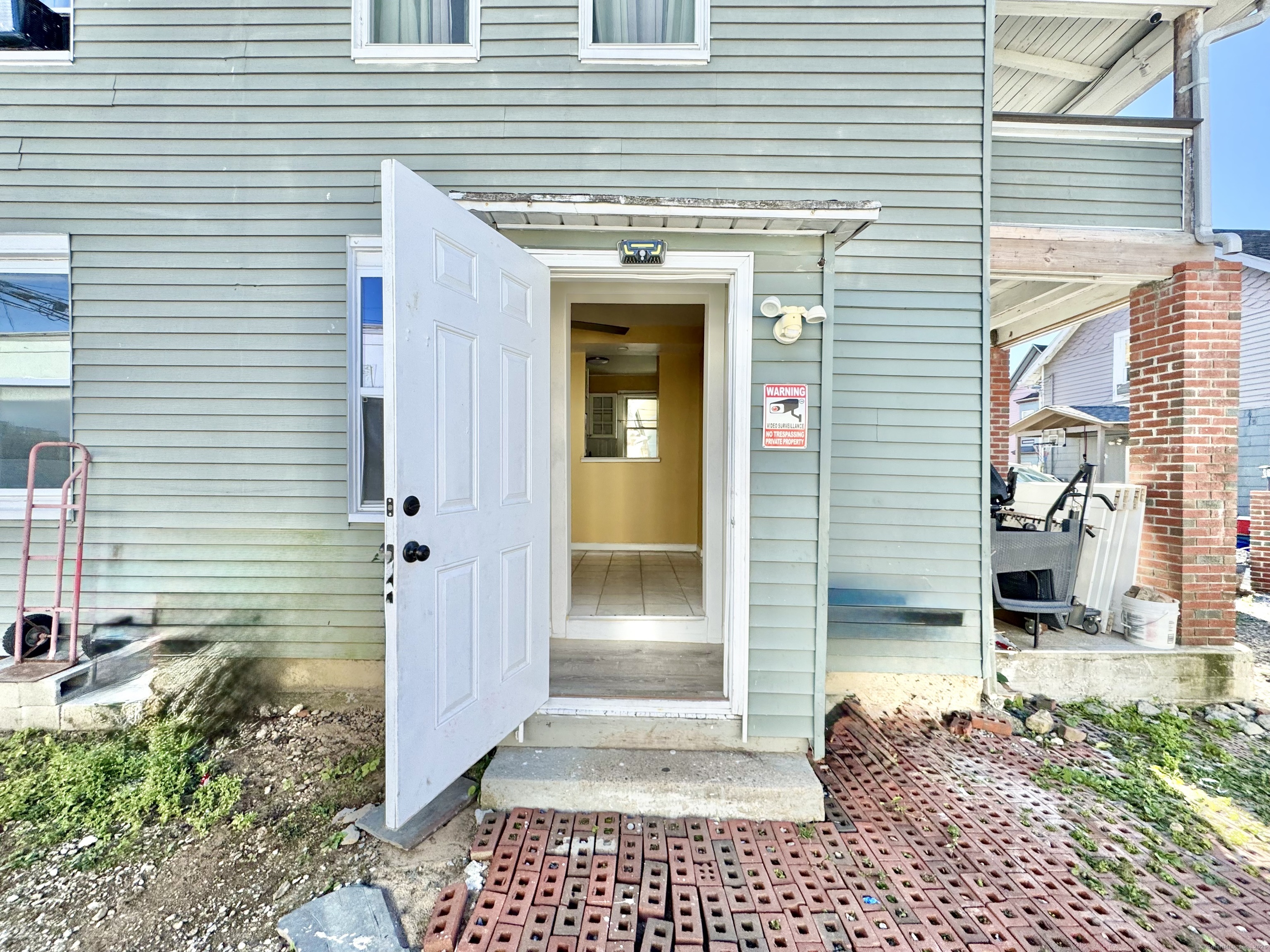 Undisclosed Address Bridgeport, CT 06608 - Photo 17 of 18 a view of a entryway door front of house