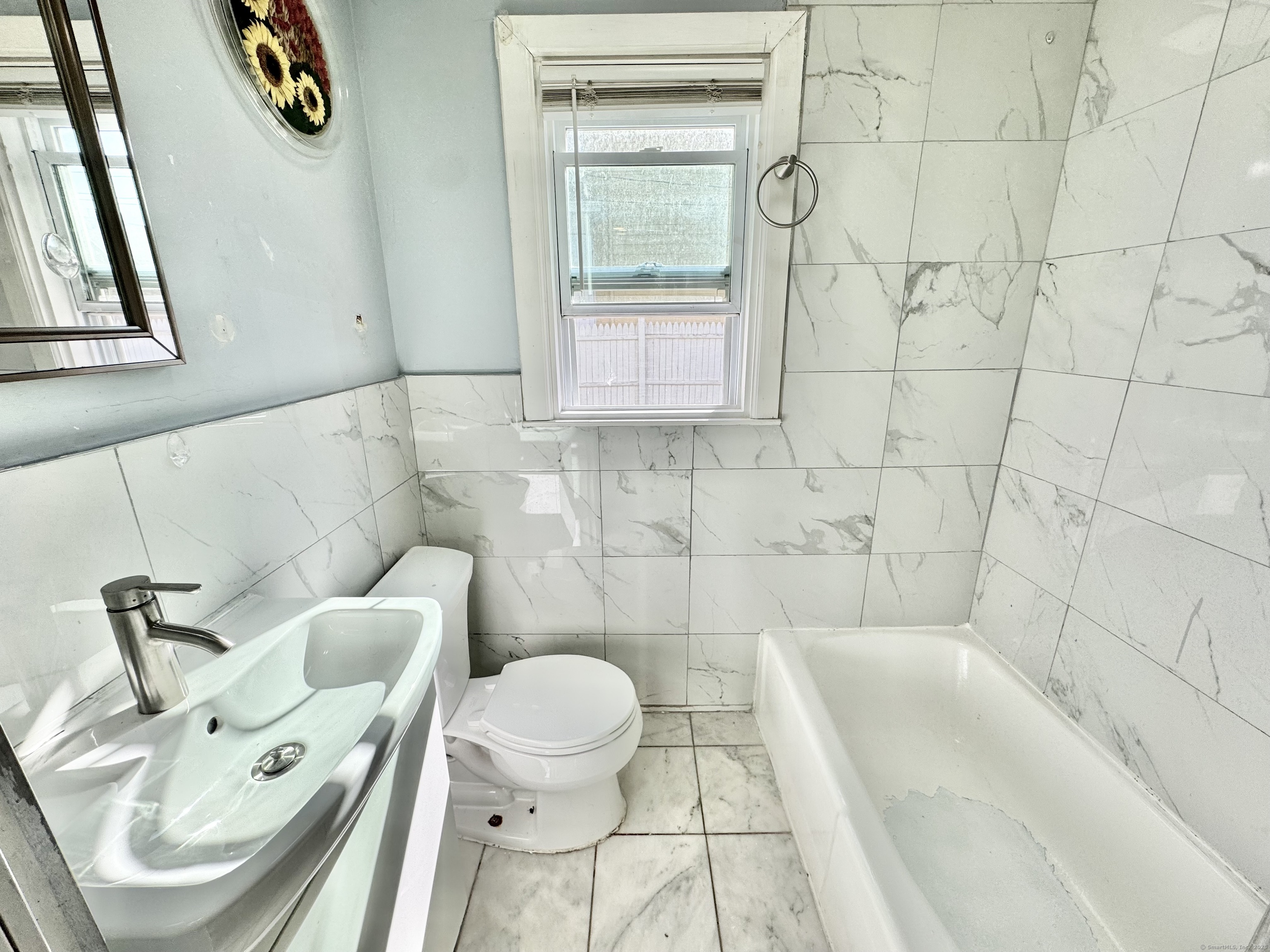 Undisclosed Address Bridgeport, CT 06608 - Photo 8 of 18 a bathroom with a sink toilet and shower