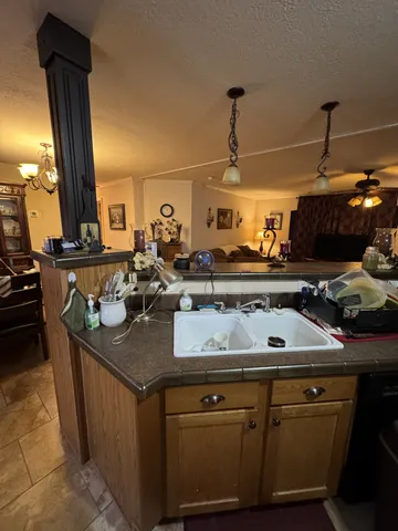 a kitchen with a table and chairs in it