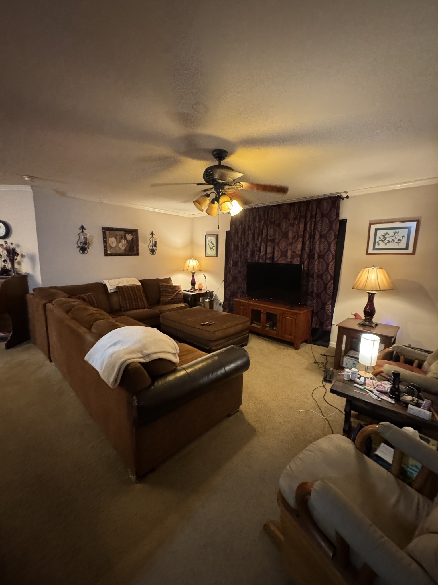 241 Greenfield Road Prospect, TN 38477 - Photo 27 of 32 a living room with furniture a fireplace and a chandelier