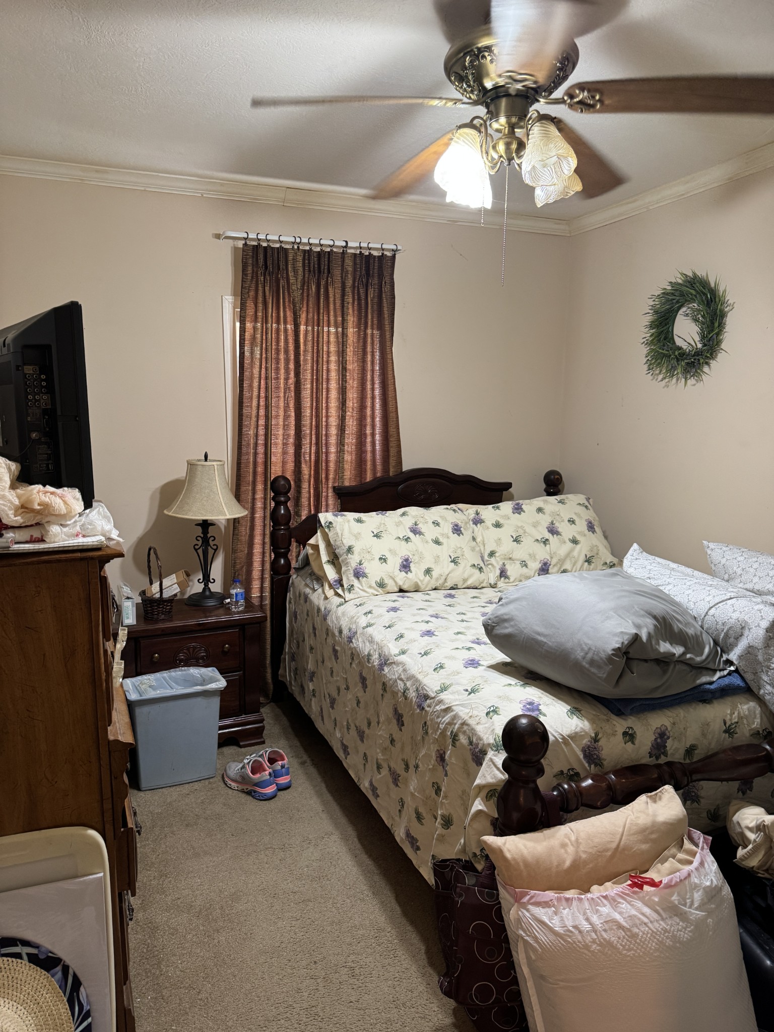 241 Greenfield Road Prospect, TN 38477 - Photo 30 of 32 a bedroom with a bed and a chandelier