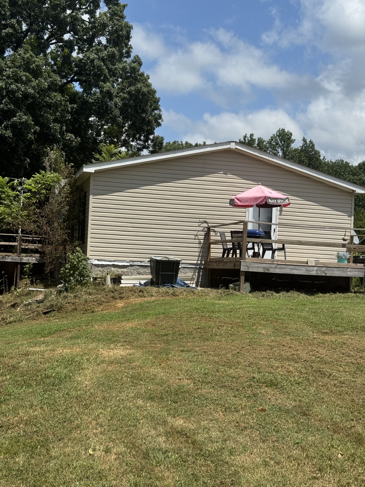 241 Greenfield Road Prospect, TN 38477 - Photo 8 of 32 a front view of a house with a garden