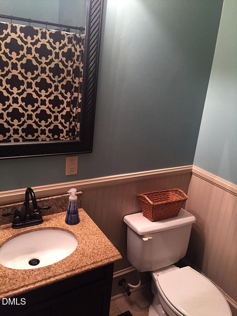 6404 Buffaloe Road Raleigh, NC 27616 - Photo 6 of 12 a bathroom with a sink and a toilet
