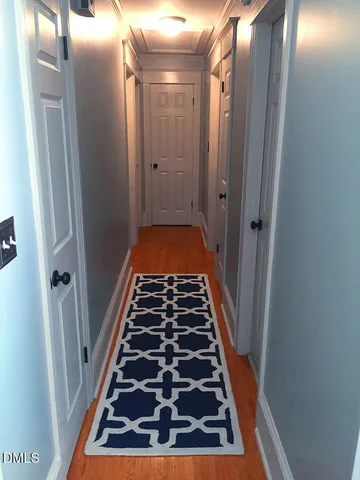 a bathroom with sink and glass door