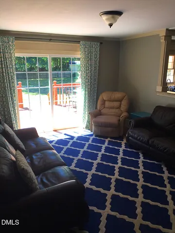 a living room with a couch and a large window