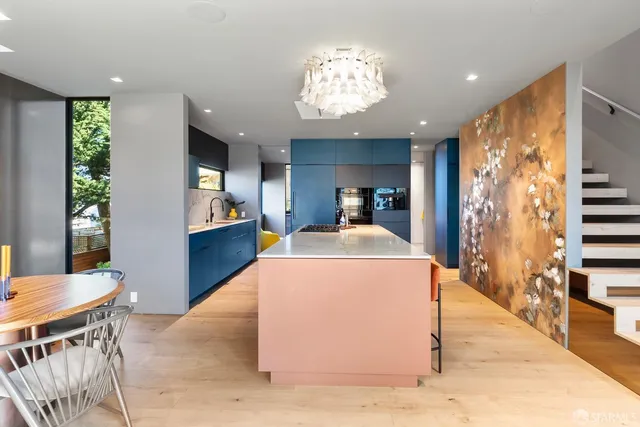 a kitchen with a refrigerator and a sink