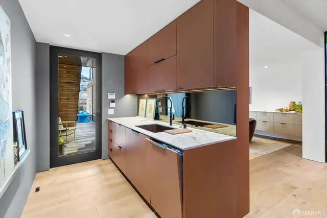 a view of entryway with wooden floor and stairs