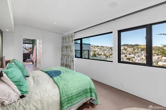 a living room with couches and a flat screen tv