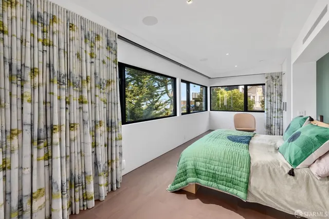 a view of hallway with furniture and a window