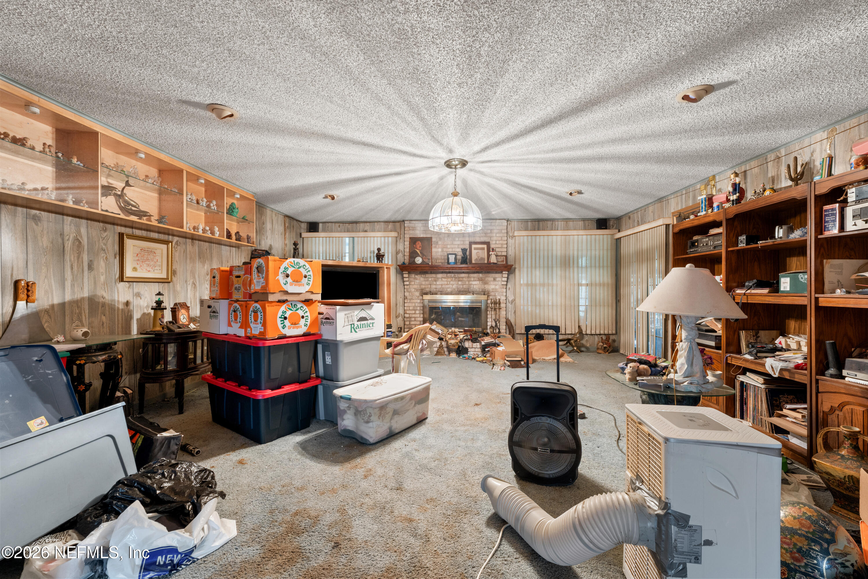 43001 Egger Place Callahan, FL 32011 - Photo 11 of 53 a room with lots of furniture and clutter