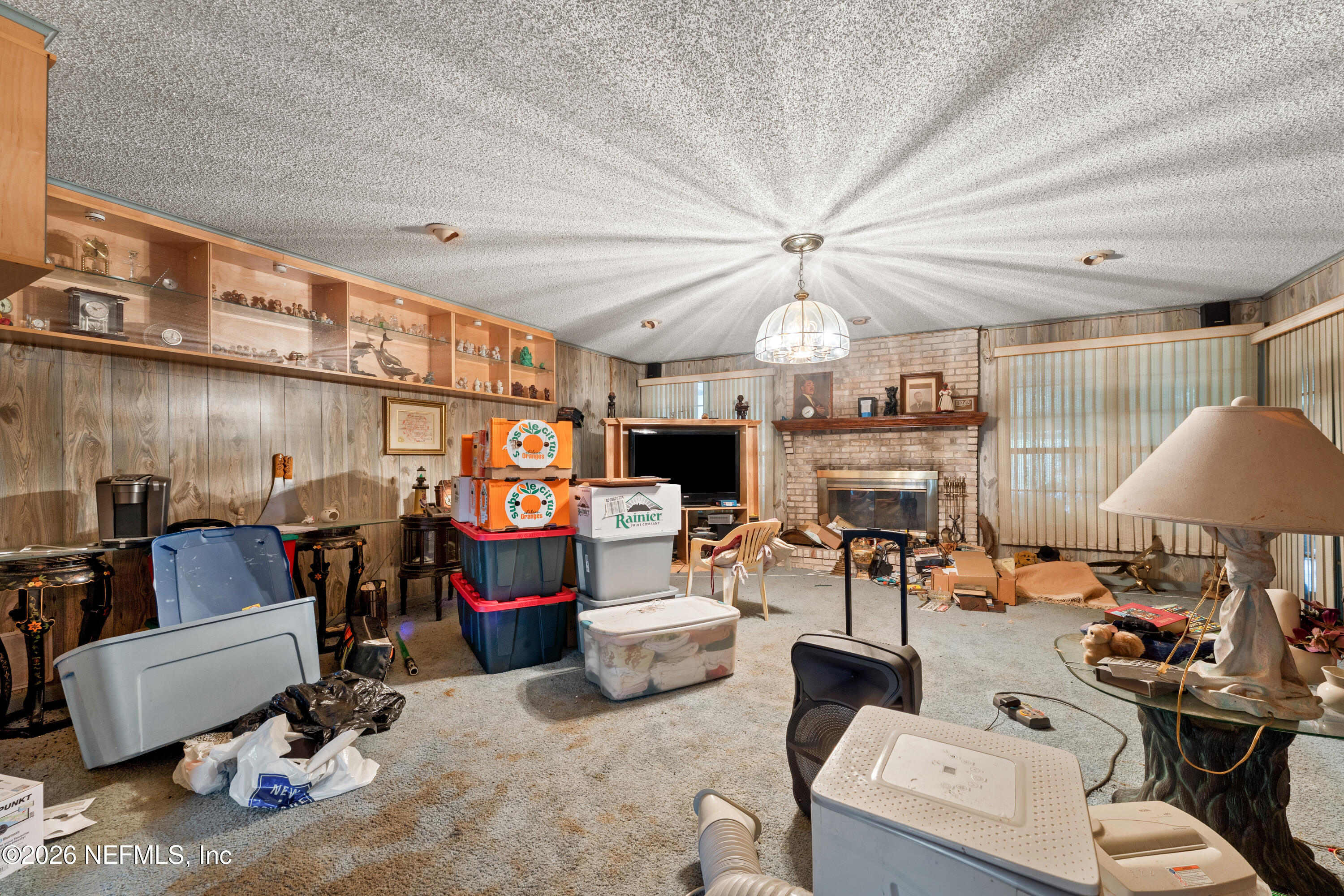 43001 Egger Place Callahan, FL 32011 - Photo 13 of 53 a living room with furniture and a flat screen tv