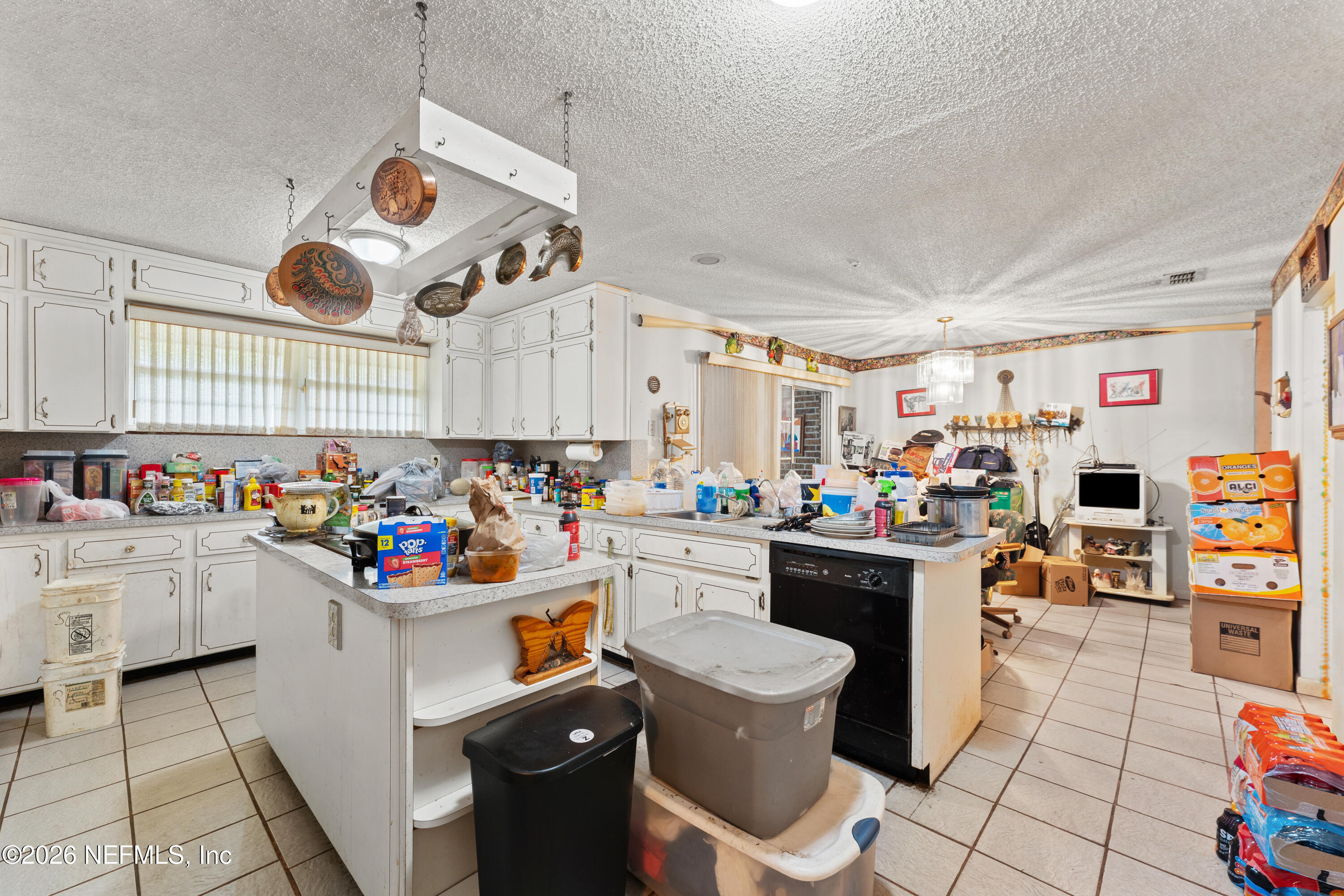 43001 Egger Place Callahan, FL 32011 - Photo 15 of 53 a kitchen filled with white cabinets and white appliances