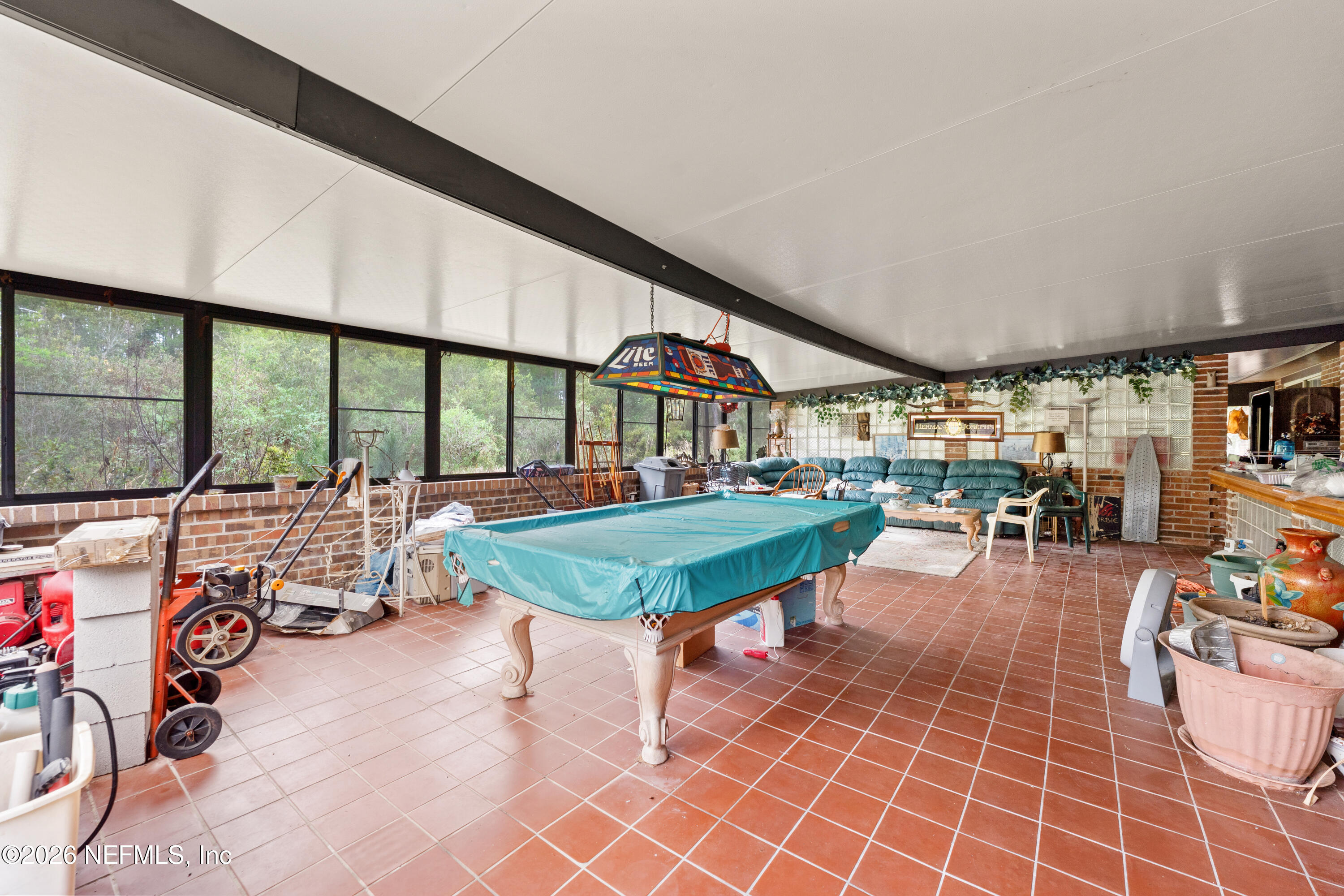 43001 Egger Place Callahan, FL 32011 - Photo 22 of 53 a living room with furniture a rug and white walls