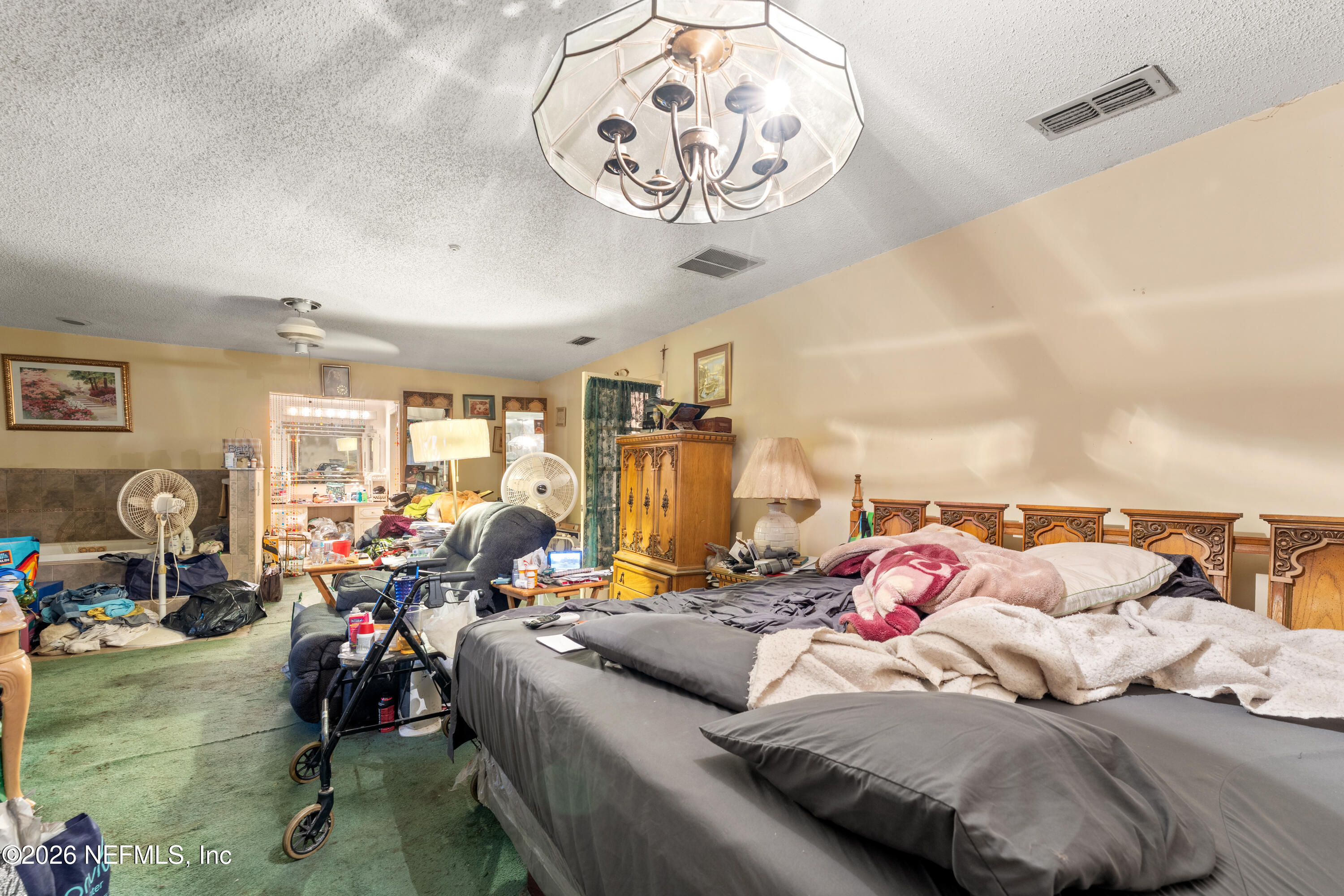 43001 Egger Place Callahan, FL 32011 - Photo 24 of 53 a bed room with a bed and a couch