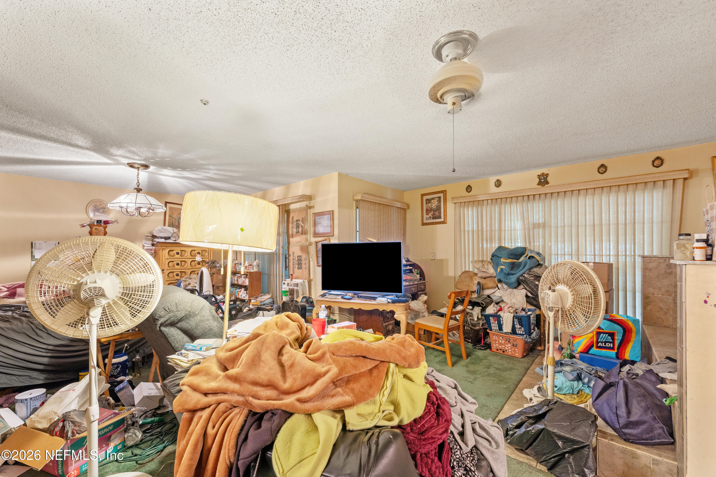 43001 Egger Place Callahan, FL 32011 - Photo 25 of 53 a view of a livingroom with furniture and a flat screen tv
