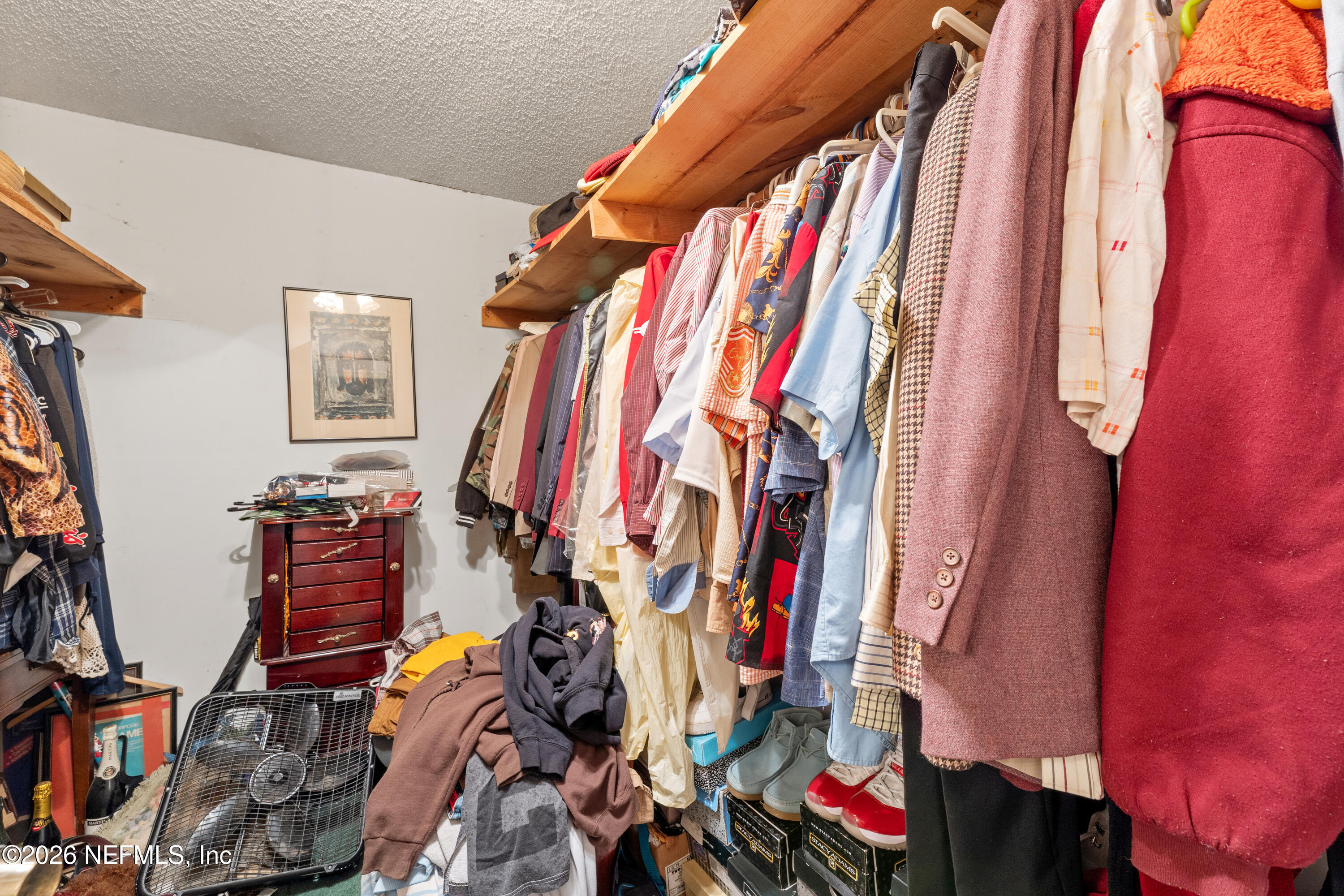 43001 Egger Place Callahan, FL 32011 - Photo 26 of 53 a view of walk in closet with clothes