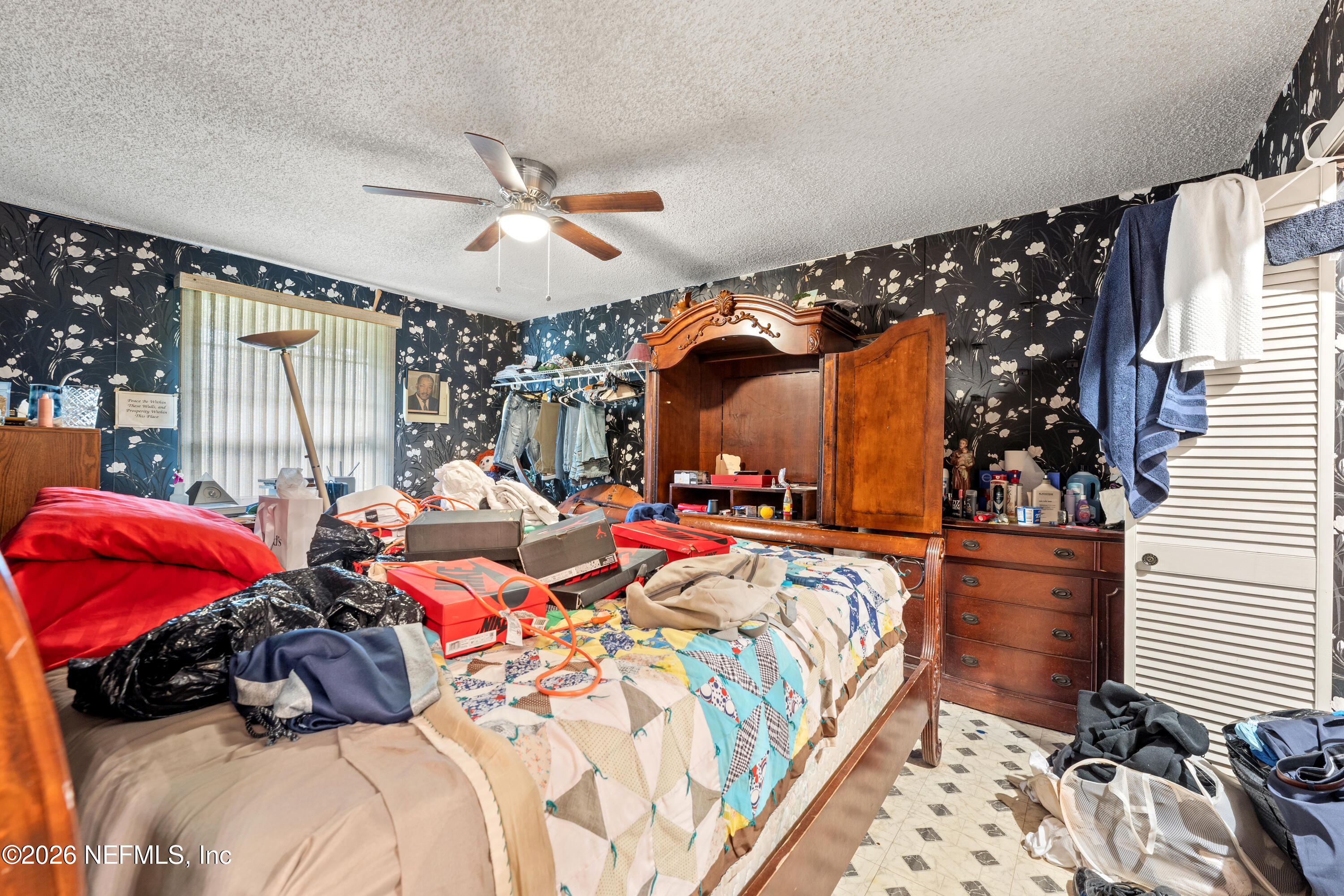 43001 Egger Place Callahan, FL 32011 - Photo 29 of 53 a bed room with a bed and a couch