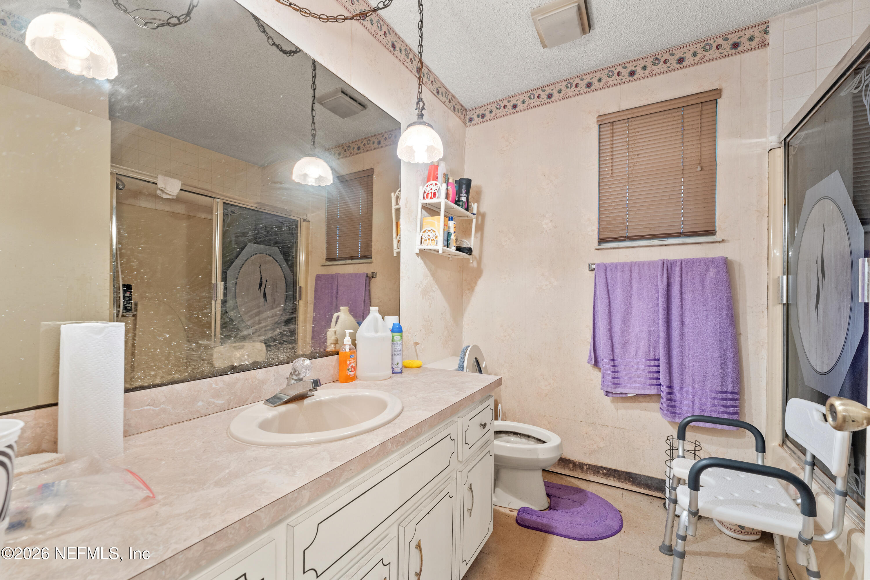 43001 Egger Place Callahan, FL 32011 - Photo 30 of 53 a bathroom with a double vanity sink mirror and toilet