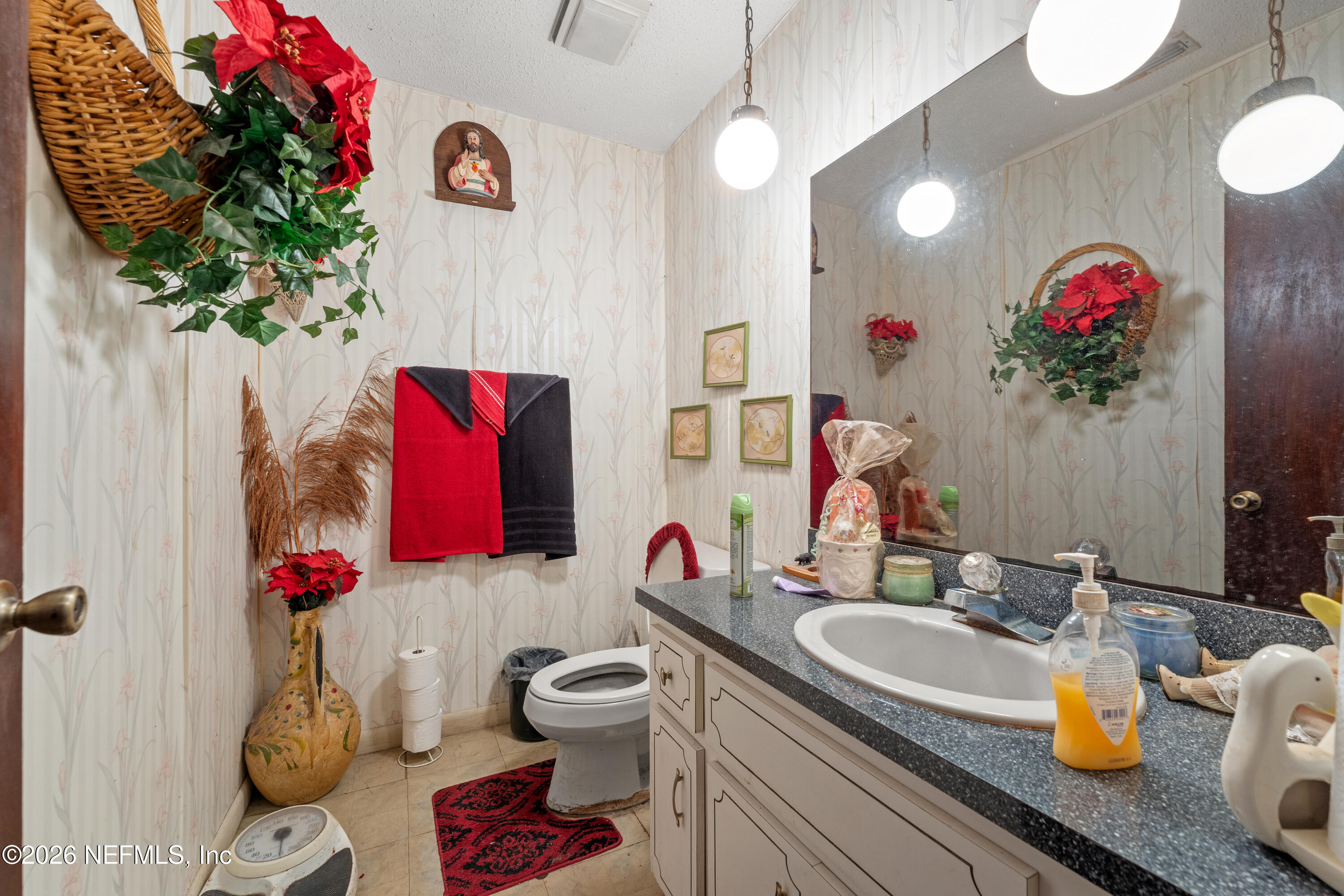 43001 Egger Place Callahan, FL 32011 - Photo 32 of 53 a bathroom with a granite countertop sink a toilet and a tub