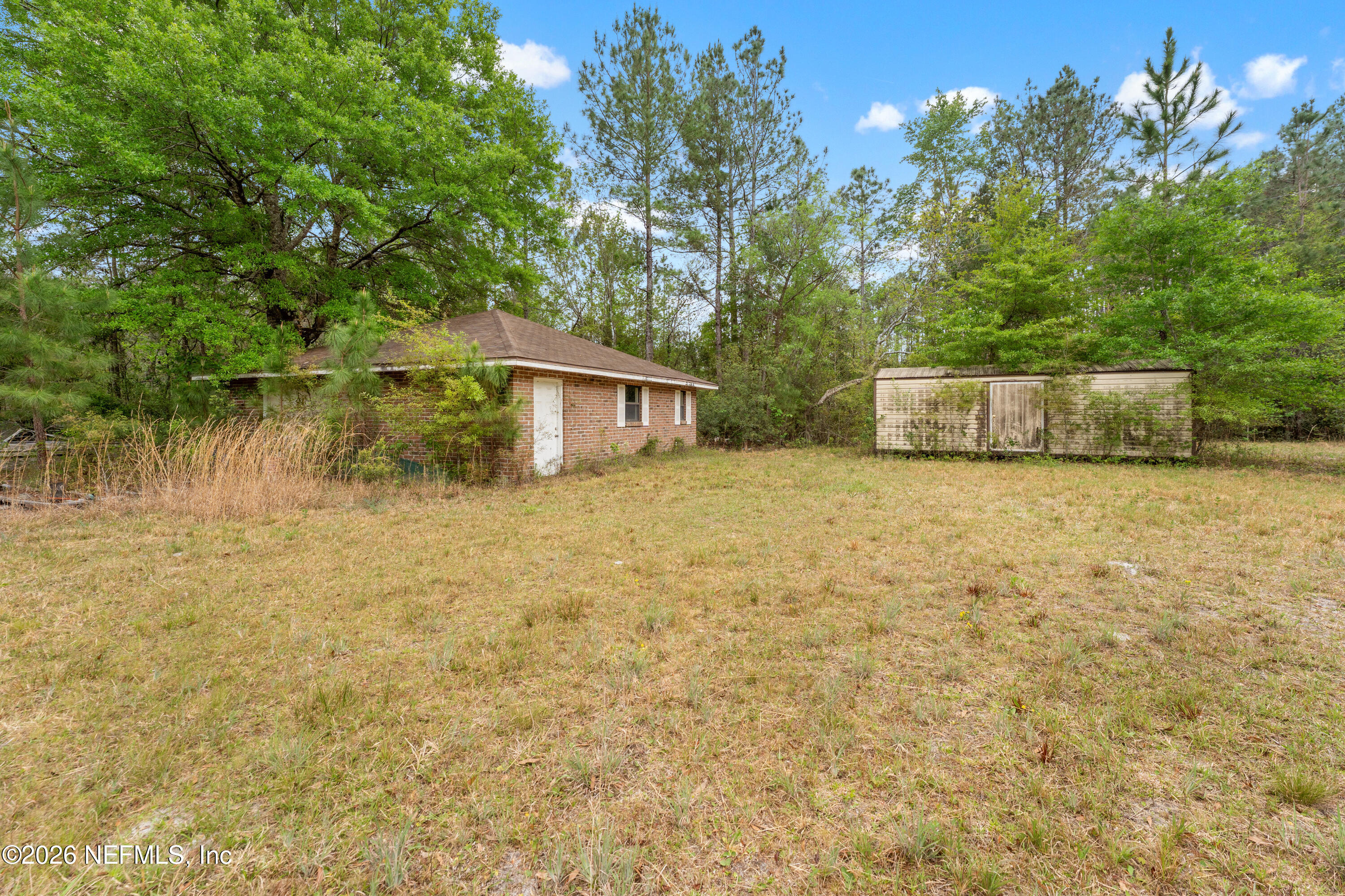 43001 Egger Place Callahan, FL 32011 - Photo 34 of 53 a view of a house with a yard