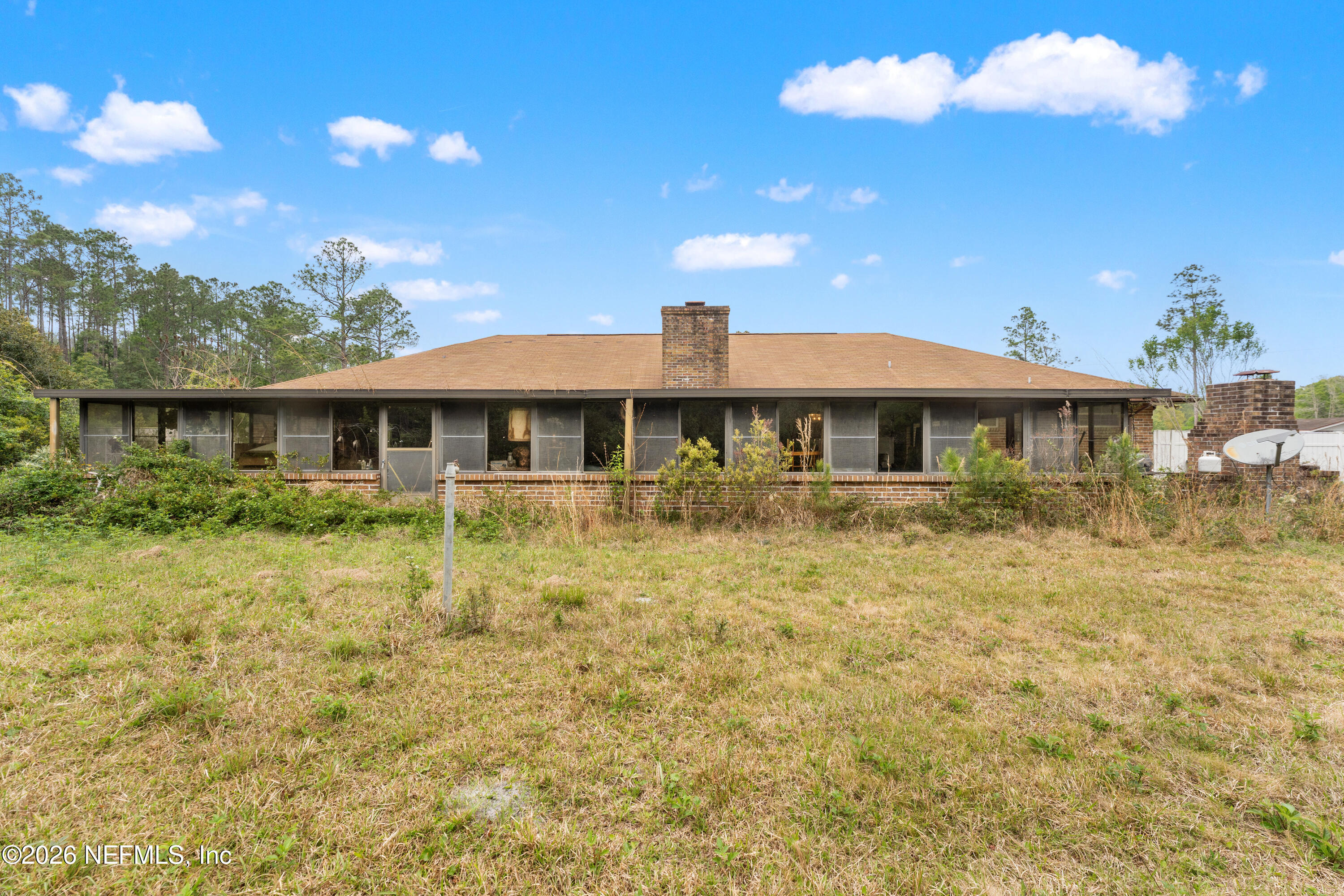 43001 Egger Place Callahan, FL 32011 - Photo 35 of 53 a front view of a house with a yard