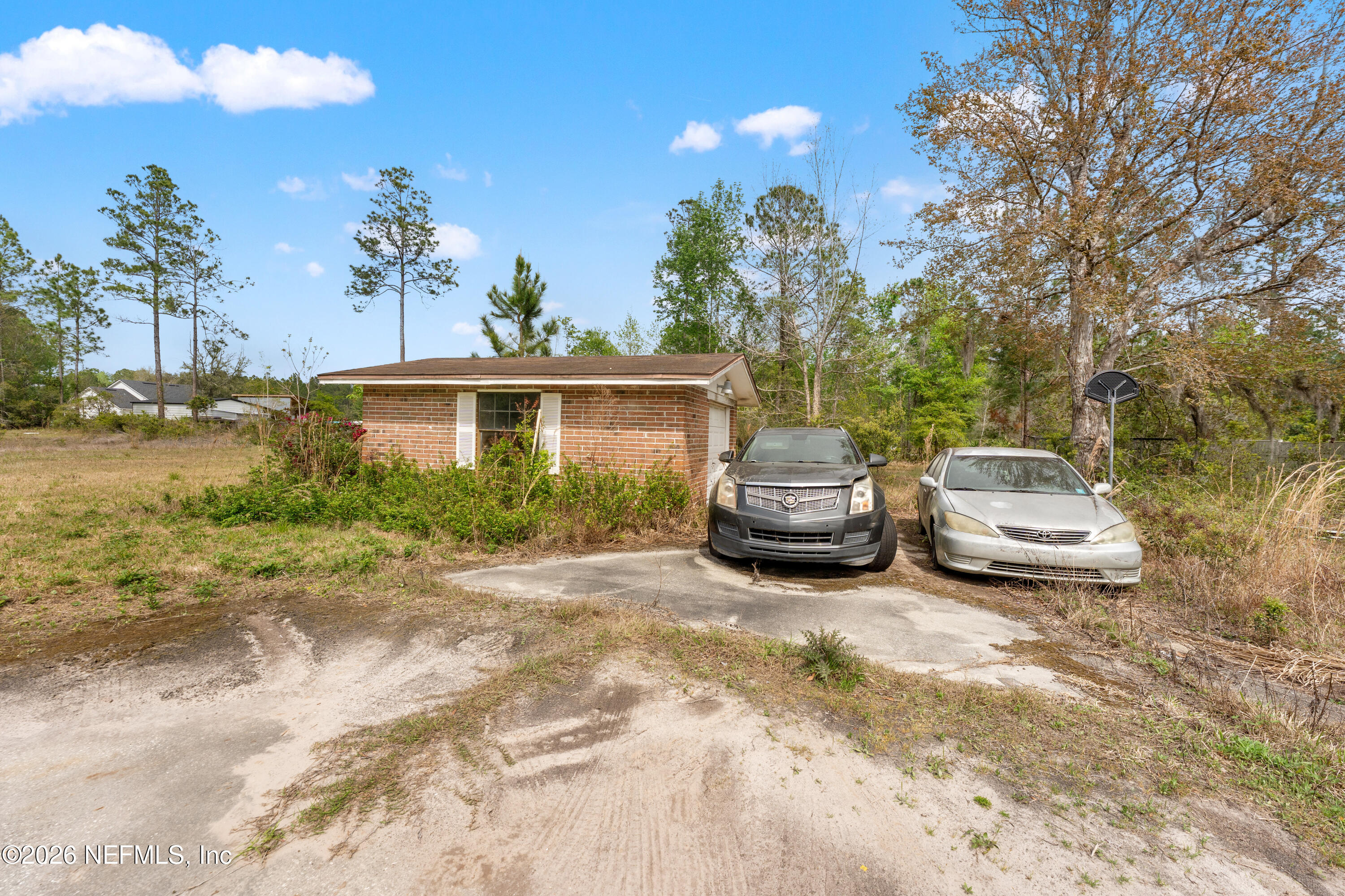 43001 Egger Place Callahan, FL 32011 - Photo 36 of 53 a front view of a house with a garden