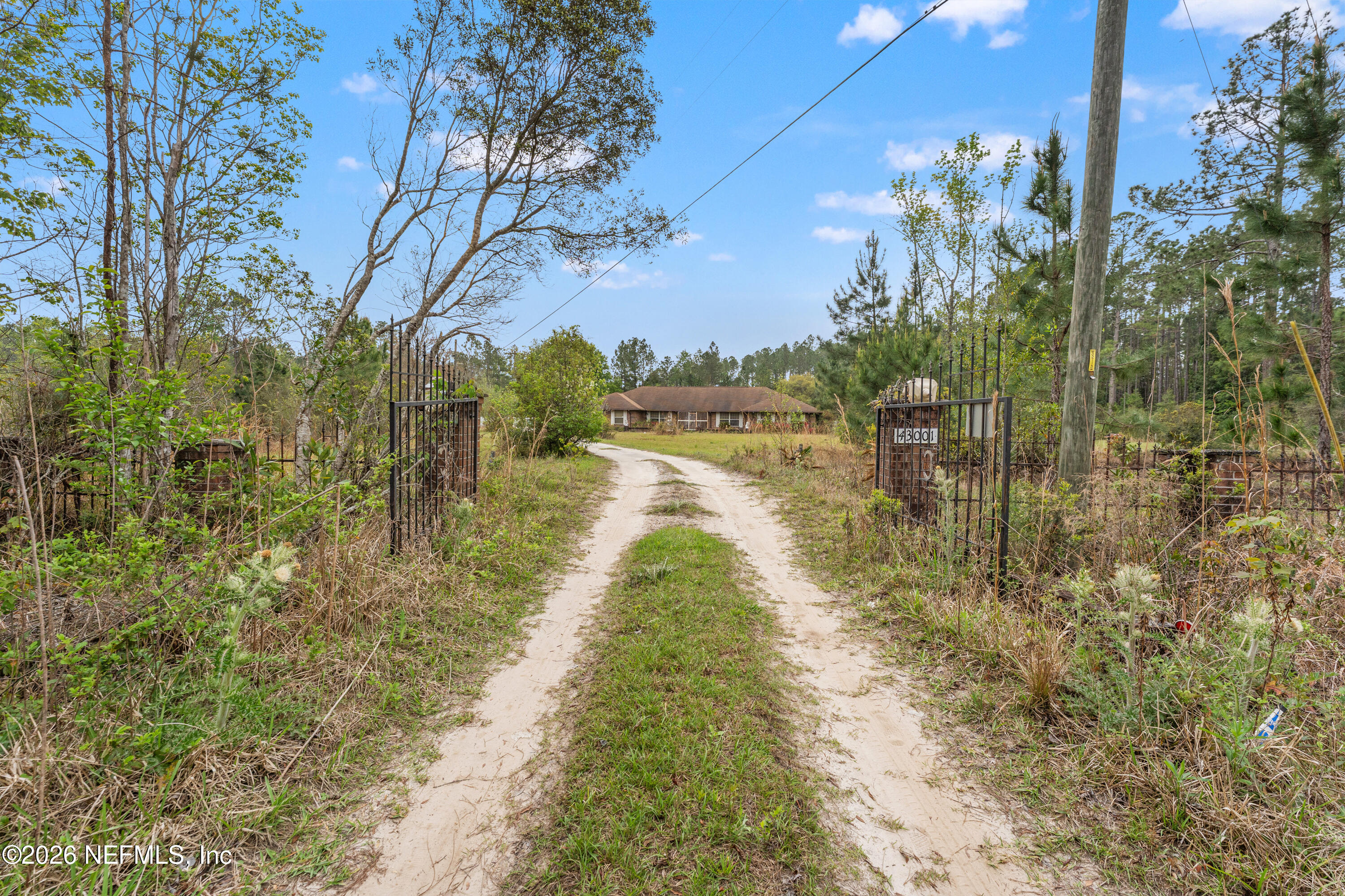43001 Egger Place Callahan, FL 32011 - Photo 37 of 53 a view of a lake with a large trees
