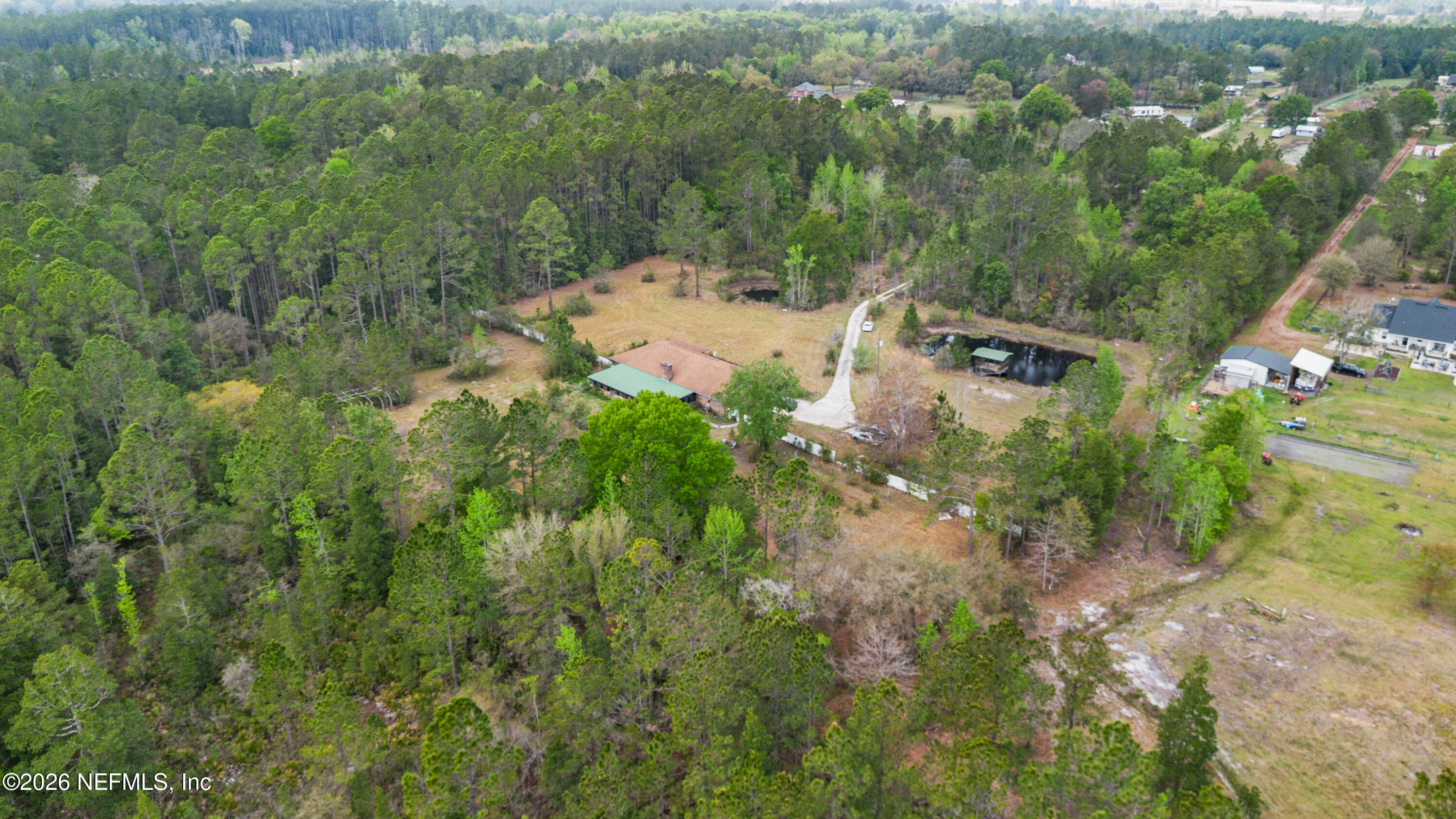 43001 Egger Place Callahan, FL 32011 - Photo 51 of 53 an aerial view of residential house with outdoor space and trees all around