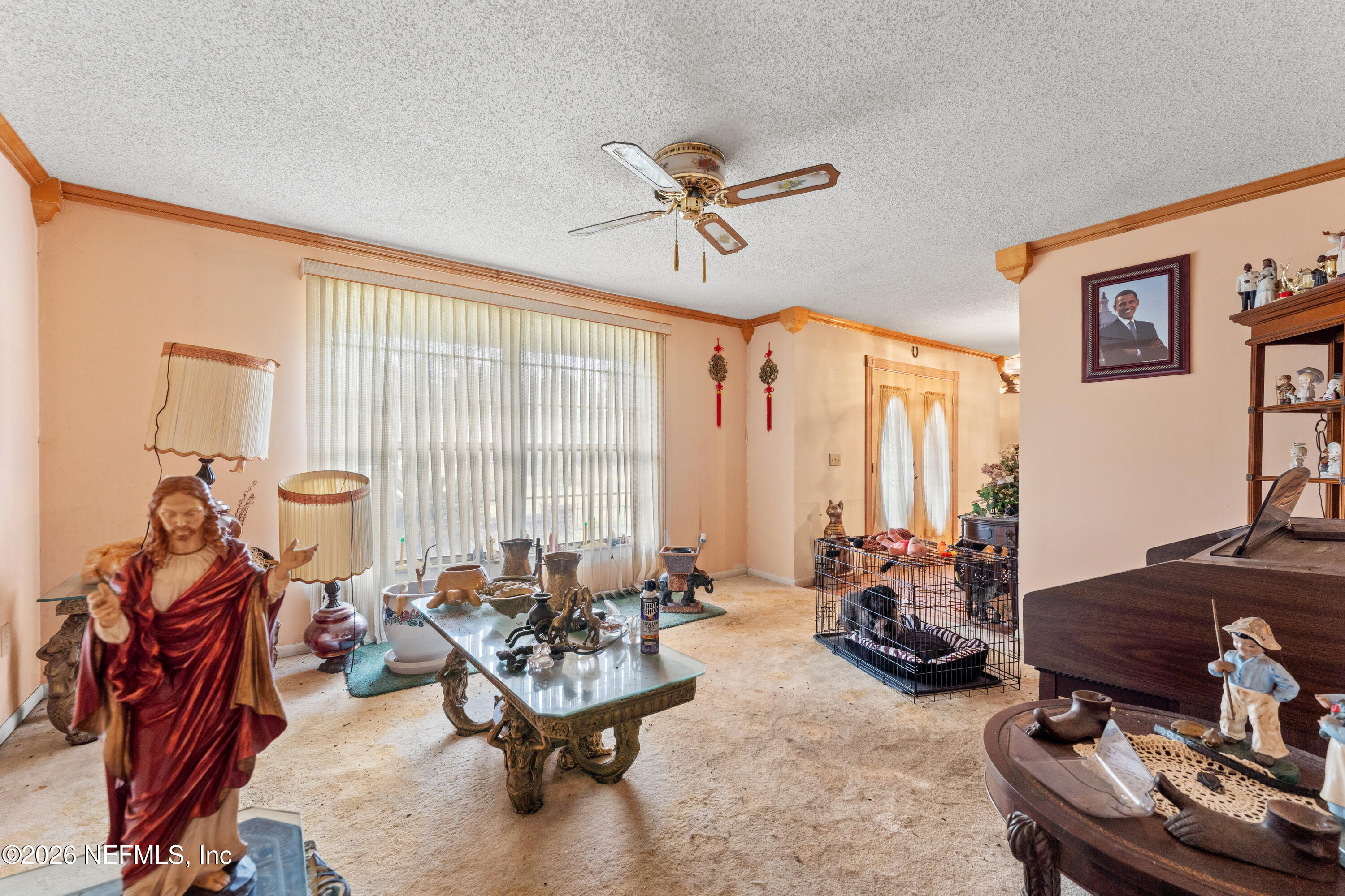 43001 Egger Place Callahan, FL 32011 - Photo 7 of 53 a living room with furniture a rug and a large window