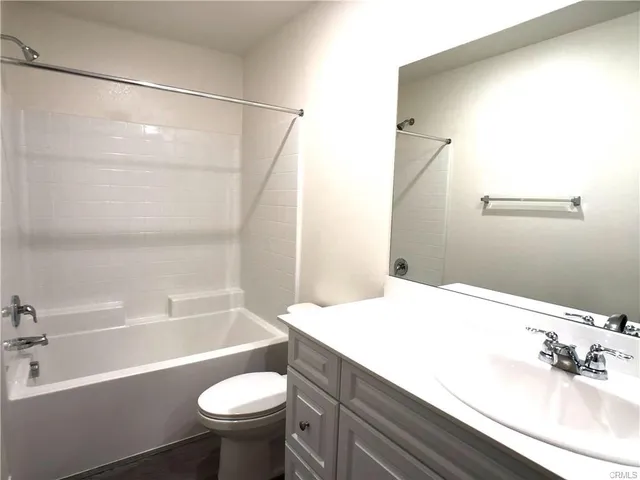 a bathroom with a sink a toilet and a bathtub