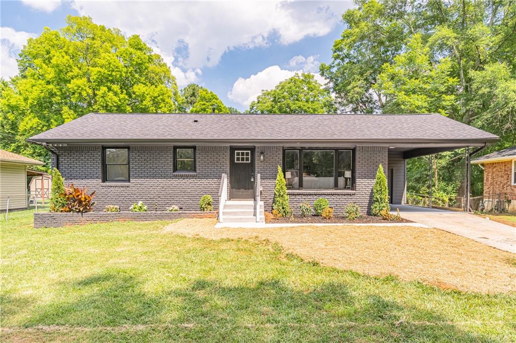 1978 Creekside Court Decatur, GA 30032 - Photo 1 of 1 a house with a swimming pool in front of it