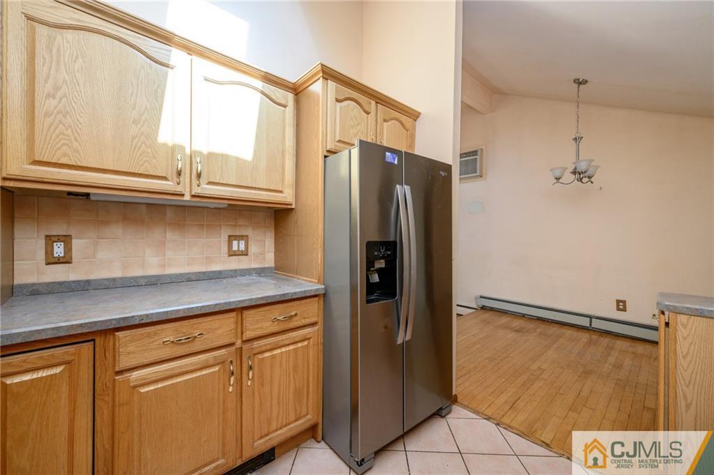7 Florence Drive Sayreville, NJ 08859 - Photo 13 of 42 a kitchen with stainless steel appliances granite countertop a refrigerator and a sink