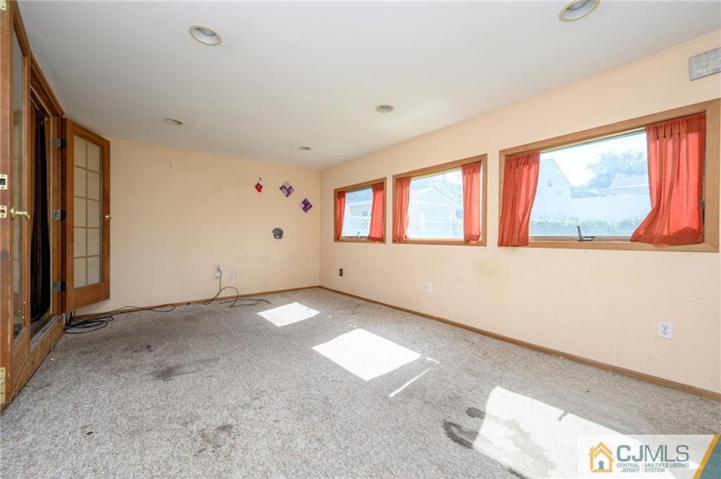 7 Florence Drive Sayreville, NJ 08859 - Photo 17 of 42 a view of an empty room with a window